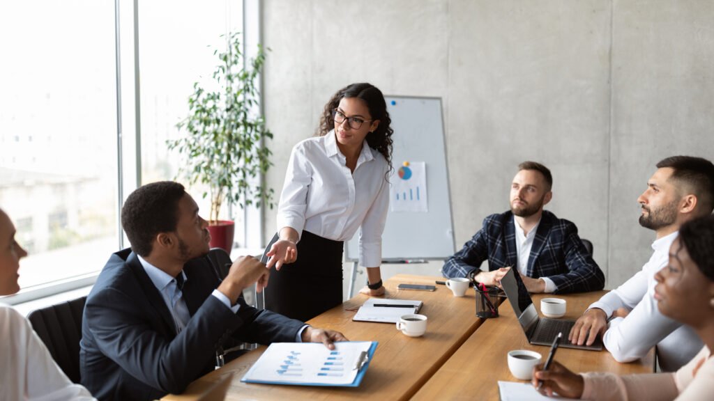 Businesswoman On Business Meeting Talking With Colleagues Standing In Office
IT project management services